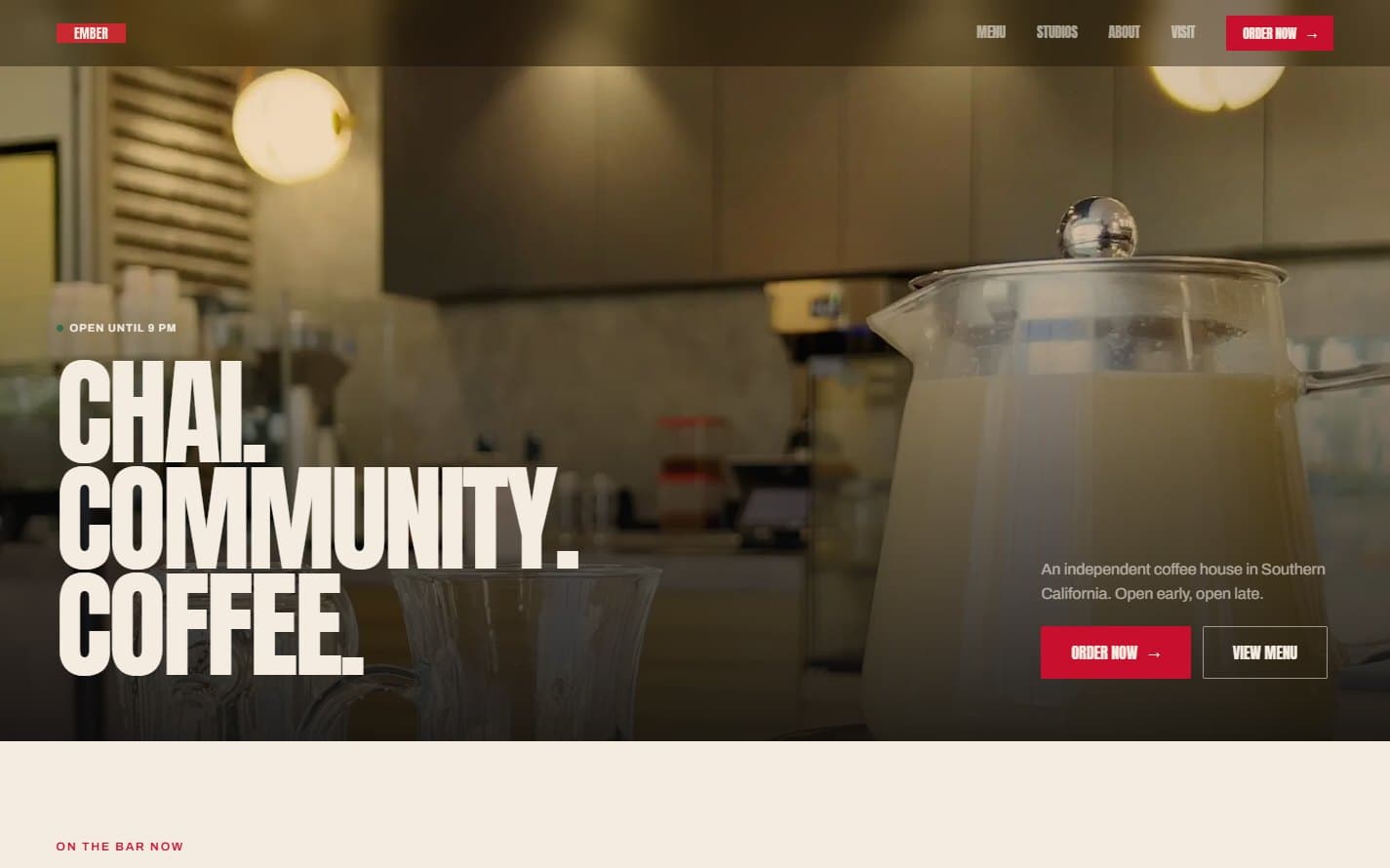 The homepage hero, setting a three-word positioning line over the flagship interior.