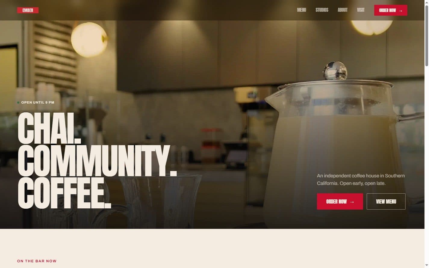 The homepage hero, setting a three-line positioning statement over the flagship interior.
